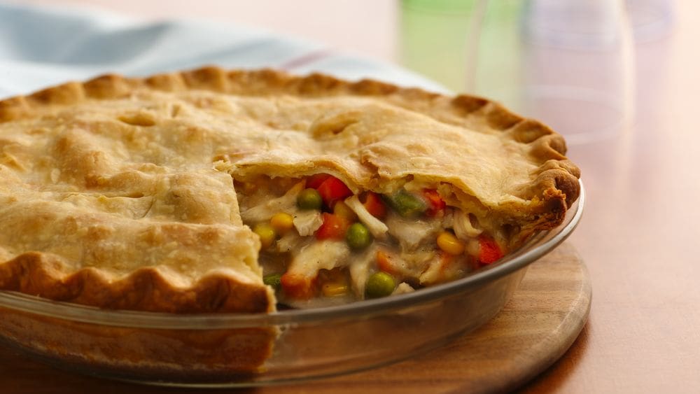 Warm chicken pot pie with a slice cut out